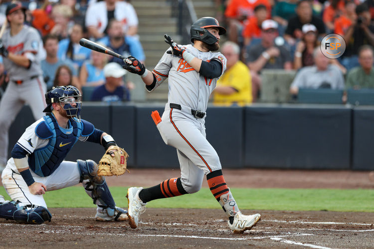Jun 18, 2025; Tampa, Florida, USA; Baltimore Orioles left fielder Colton Cowser (17) hits a three run home run against the Tampa Bay Rays in the second inning at George M. Steinbrenner Field. Credit: Nathan Ray Seebeck-Imagn Images