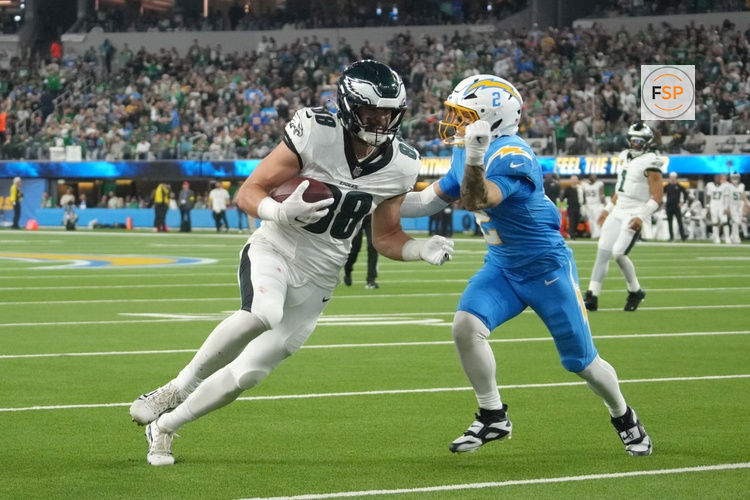 Dec 8, 2025; Inglewood, California, USA; Los Angeles Chargers cornerback Elijah Molden (2) tackles Philadelphia Eagles tight end Dallas Goedert (88) in the first half at SoFi Stadium. Credit: Kirby Lee-Imagn Images