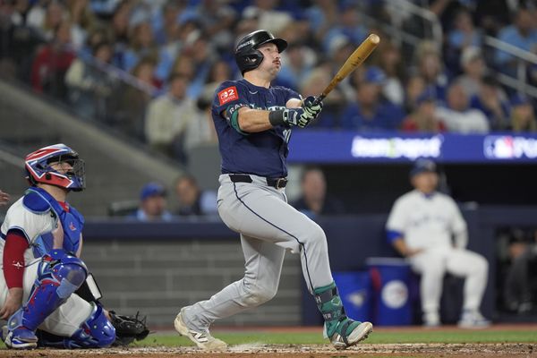 Oct 20, 2025; Toronto, Ontario, CAN; Seattle Mariners catcher Cal Raleigh (29) hits a solo home run against the Toronto Blue Jays in the fifth inning during game seven of the ALCS round for the 2025 MLB playoffs at Rogers Centre. Mandatory Credit: John E. Sokolowski-Imagn Images
