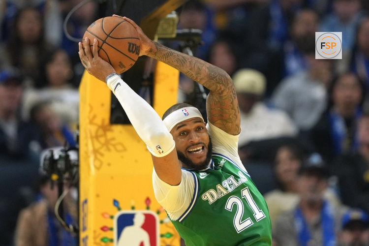 Dec 25, 2025; San Francisco, California, USA; Dallas Mavericks forward Daniel Gafford (21) rebounds against the Golden State Warriors during the second quarter at Chase Center. Credit: Darren Yamashita-Imagn Images
