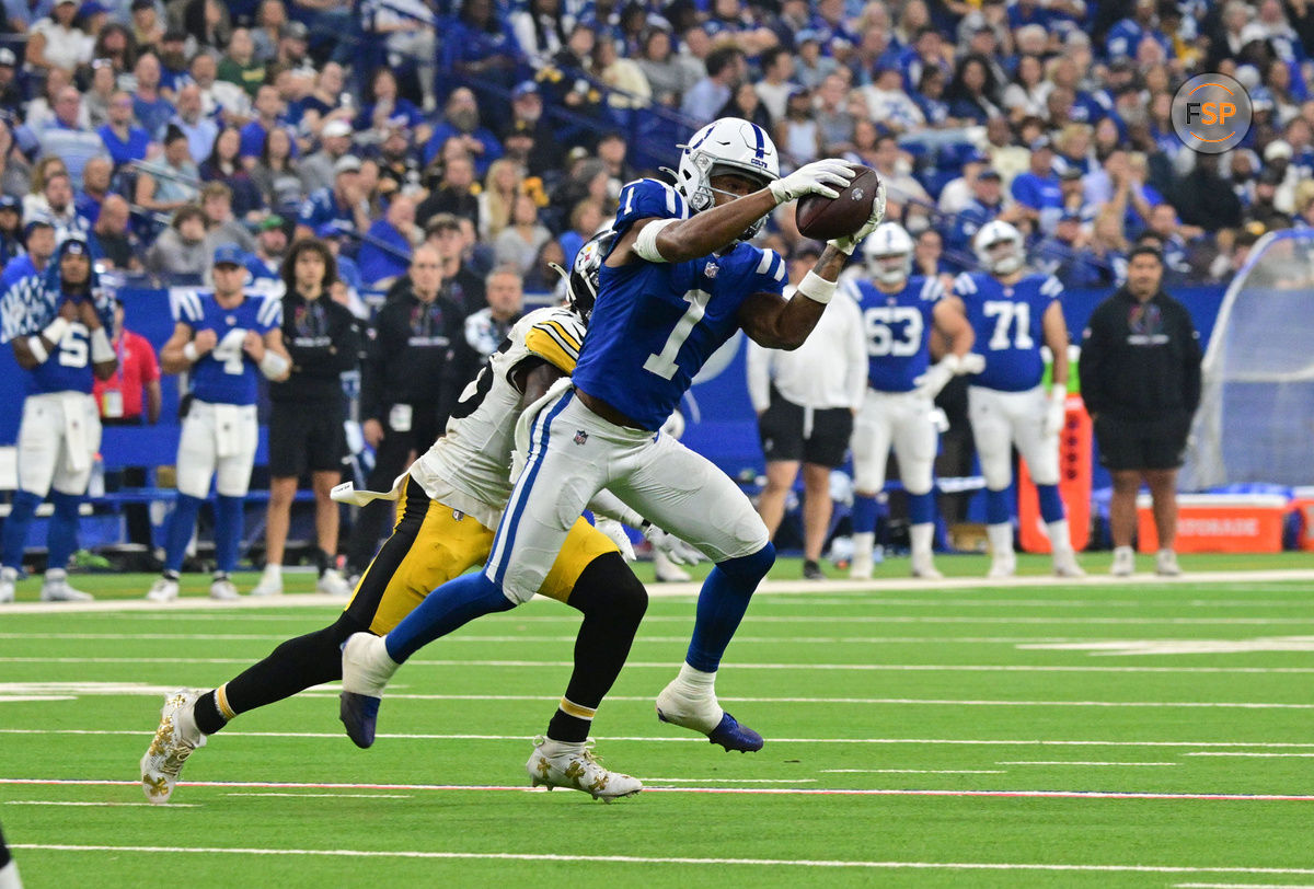 Sep 29, 2024; Indianapolis, Indiana, USA; Indianapolis Colts wide receiver Josh Downs (1) catches a pass in front of Pittsburgh Steelers safety DeShon Elliott (25) during the second quarter at Lucas Oil Stadium. Credit: Marc Lebryk-Imagn Images