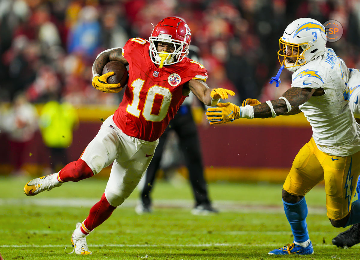 Dec 8, 2024; Kansas City, Missouri, USA; Kansas City Chiefs running back Isiah Pacheco (10) runs with the ball against Los Angeles Chargers safety Derwin James Jr. (3) during the second half at GEHA Field at Arrowhead Stadium. Credit: Jay Biggerstaff-Imagn Images