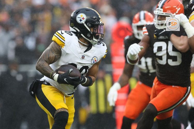 Dec 28, 2025; Cleveland, Ohio, USA; Pittsburgh Steelers running back Jaylen Warren (30) runs the ball in the second quarter against the Cleveland Browns at Huntington Bank Field. Credit: Scott Galvin-Imagn Images
