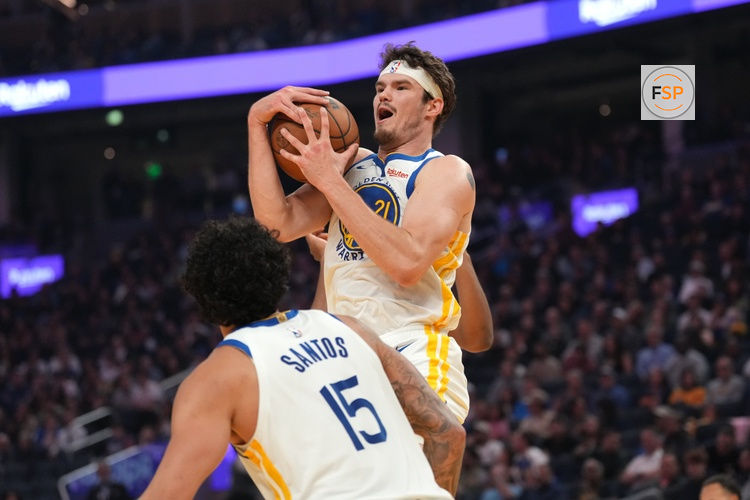 Mar 13, 2026; San Francisco, California, USA; Golden State Warriors center Quinten Post (21) holds onto a rebound against the Minnesota Timberwolves in the first quarter at the Chase Center. Credit: Cary Edmondson-Imagn Images