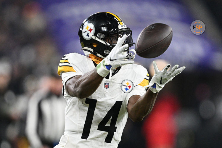 Jan 11, 2025; Baltimore, Maryland, USA; Pittsburgh Steelers wide receiver George Pickens (14) makes a catch against the Baltimore Ravens in the third quarter in an AFC wild card game at M&T Bank Stadium. Credit: Tommy Gilligan-Imagn Images