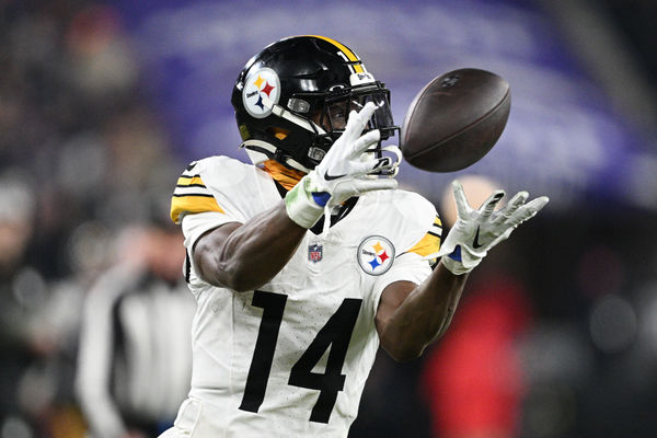 Jan 11, 2025; Baltimore, Maryland, USA; Pittsburgh Steelers wide receiver George Pickens (14) makes a catch against the Baltimore Ravens in the third quarter in an AFC wild card game at M&T Bank Stadium. Mandatory Credit: Tommy Gilligan-Imagn Images