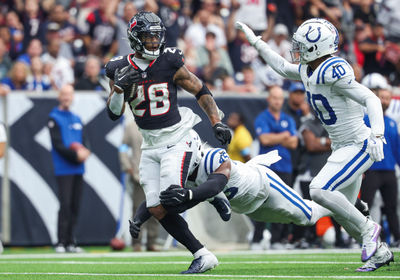 Oct 27, 2024; Houston, Texas, USA; Houston Texans running back Joe Mixon (28) runs with the ball as Indianapolis Colts linebacker E.J. Speed (45) attempts to make a tackle during the fourth quarter at NRG Stadium. Mandatory Credit: Troy Taormina-Imagn Images