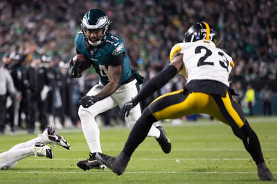 Dec 15, 2024; Philadelphia, Pennsylvania, USA; Philadelphia Eagles running back Kenneth Gainwell (14) runs with the ball against Pittsburgh Steelers safety Damontae Kazee (23) during the second quarter at Lincoln Financial Field. Mandatory Credit: Bill Streicher-Imagn Images