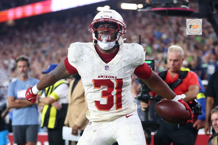 Sep 25, 2025; Glendale, Arizona, USA;  Arizona Cardinals running back Emari Demercado (31) celebrates scoring a touchdown against the Seattle Seahawks in the fourth quarter at State Farm Stadium. Credit: Mark J. Rebilas-Imagn Images