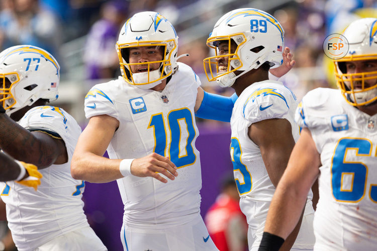 MINNEAPOLIS, MN - SEPTEMBER 24: Los Angeles Chargers quarterback Justin Herbert (10) celebrates a touchdown with quarterback Justin Herbert (10) during the NFL game between the Los Angles Chargers and the Minnesota Vikings on September 24th, 2023, at U.S. Bank Stadium in Minneapolis, MN. (Photo by Bailey Hillesheim/Icon Sportswire)