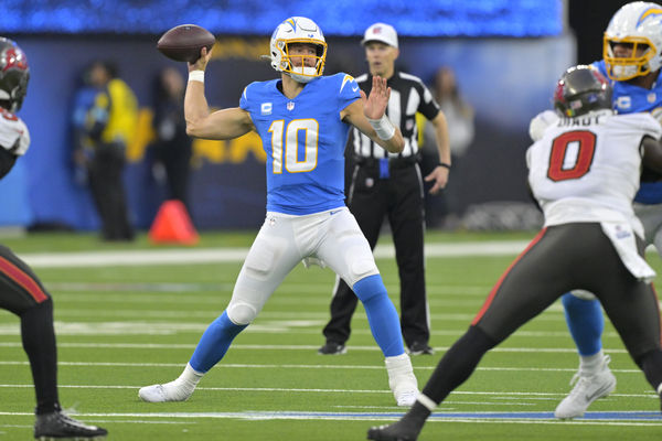 Dec 15, 2024; Inglewood, California, USA; Los Angeles Chargers quarterback Justin Herbert (10) throws a pass in the second half against the Tampa Bay Buccaneers at SoFi Stadium. Mandatory Credit: Jayne Kamin-Oncea-Imagn Images