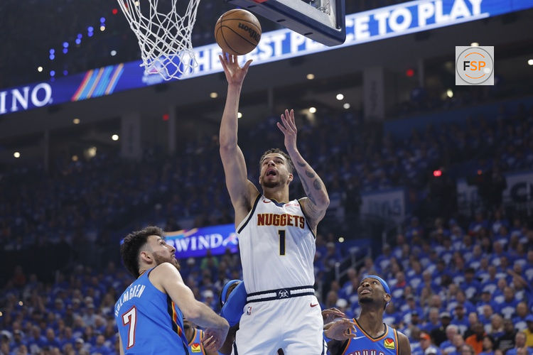 May 18, 2025; Oklahoma City, Oklahoma, USA; Denver Nuggets forward Michael Porter Jr. (1) shoots beside Oklahoma City Thunder forward Chet Holmgren (7) in the first quarter during game seven of the second round for the 2025 NBA Playoffs at Paycom Center. Credit: Alonzo Adams-Imagn Images
