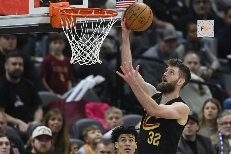 Dec 14, 2025; Cleveland, Ohio, USA; Cleveland Cavaliers forward Dean Wade (32) drives to the basket in the fourth quarter against the Charlotte Hornets at Rocket Arena. Credit: David Richard-Imagn Images