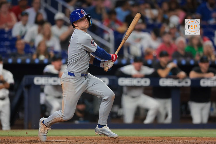 May 20, 2025; Miami, Florida, USA; Chicago Cubs third baseman Matt Shaw (6) hits an RBI double against the Miami Marlins during the sixth inning at loanDepot Park. Credit: Sam Navarro-Imagn Images