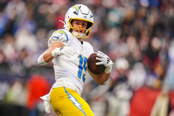 Dec 28, 2024; Foxborough, Massachusetts, USA; Los Angeles Chargers wide receiver Ladd McConkey (15) makes the touchdown catch against the New England Patriots in the third quarter at Gillette Stadium. Mandatory Credit: David Butler II-Imagn Images