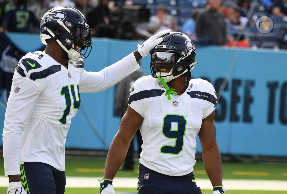 Dec 24, 2023; Nashville, Tennessee, USA; Seattle Seahawks wide receiver DK Metcalf (14) and running back Kenneth Walker III (9) before the game against the Tennessee Titans at Nissan Stadium. Credit: Christopher Hanewinckel-USA TODAY Sports