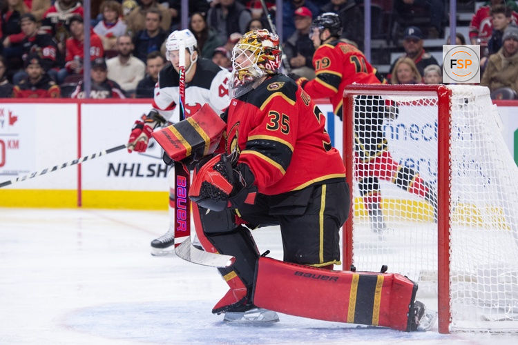 Dec 9, 2025; Ottawa, Ontario, CAN; Ottawa Senators goalie Linus Ullmark (35) makes a save on a shot from New Jersey Devils left wing Paul Coter (47) in the second period at the Canadian Tire Centre. Credit: Marc DesRosiers-IMAGN Images