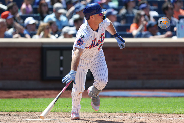 May 11, 2025; New York City, New York, USA; New York Mets first baseman Pete Alonso (20) hits a double during the eighth inning against the Chicago Cubs at Citi Field. Credit: Vincent Carchietta-Imagn Images
