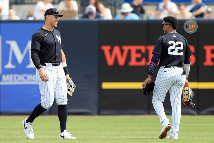 TAMPA, FL - MARCH 06: New York Yankees outfielders Aaron Judge (99) and Juan Soto (22) talk as they walk out to the outfield during the spring training game between the Tampa Bay Rays and New York Yankees on MARCH 06, 2024 at George M. Steinbrenner Field in Tampa, FL. (Photo by Cliff Welch/Icon Sportswire)