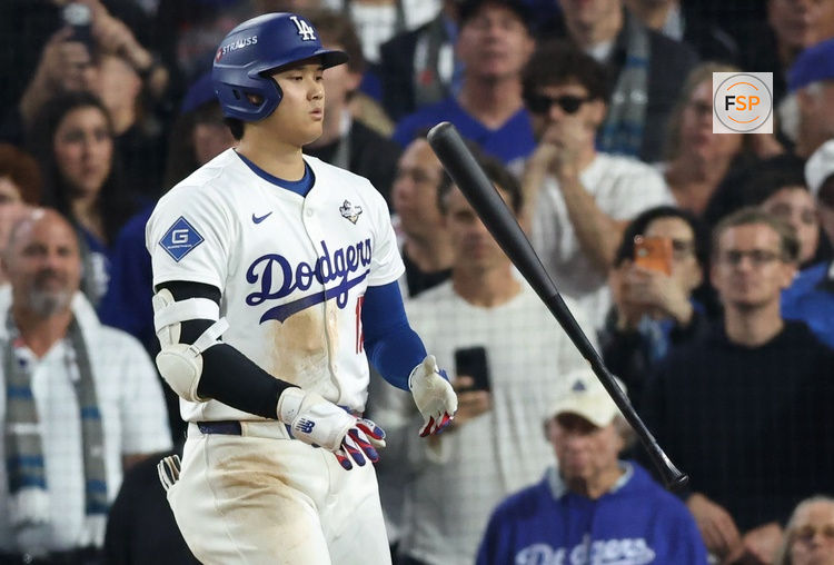 Oct 27, 2025; Los Angeles, California, USA; Los Angeles Dodgers designated hitter Shohei Ohtani (17) is intentionally walked during the eleventh inning against the Toronto Blue Jays in game three of the 2025 MLB World Series at Dodger Stadium. Credit: Kiyoshi Mio-Imagn Images