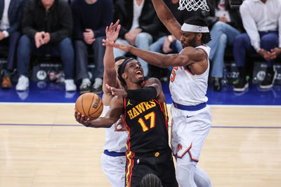 Feb 12, 2025; New York, New York, USA;  Atlanta Hawks forward Onyeka Okongwu (17) looks to drive past New York Knicks forward Precious Achiuwa (5) in overtime at Madison Square Garden. Mandatory Credit: Wendell Cruz-Imagn Images