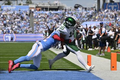 Sep 13, 2026; Nashville, Tennessee, USA;  New York Jets tight end Kenyon Sadiq (16) scores a touchdown after a catch against the Tennessee Titans linebacker James Williams Sr. (52) during the first quarter at Nissan Stadium.  Mandatory Credit: Steve Roberts-Imagn Images