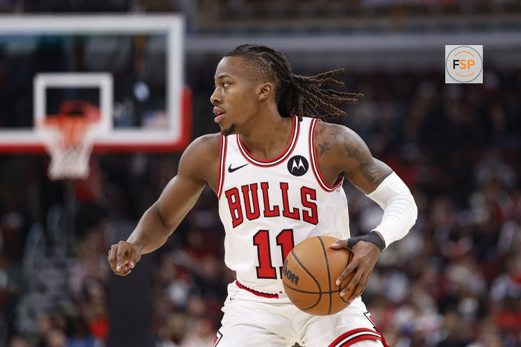 Jan 10, 2026; Chicago, Illinois, USA; Chicago Bulls guard Ayo Dosunmu (11) brings the ball up court against the Dallas Mavericks during the first half at United Center. Credit: Kamil Krzaczynski-Imagn Images