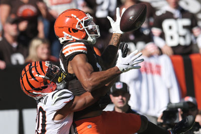 Oct 20, 2024; Cleveland, Ohio, USA; Cincinnati Bengals cornerback DJ Turner II (20) interferes with Cleveland Browns wide receiver Cedric Tillman (19) on a pass play during the first half at Huntington Bank Field. Mandatory Credit: Ken Blaze-Imagn Images