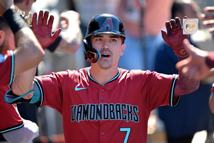 Aug 31, 2025; Los Angeles, California, USA;  Arizona Diamondbacks left fielder Corbin Carroll (7) celebrates in the dugout after hitting a three-run home run during the eighth inning off Los Angeles Dodgers relief pitcher Tanner Scott (66) at Dodger Stadium. Credit: Jayne Kamin-Oncea-Imagn Images