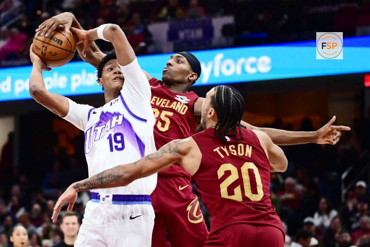 Jan 12, 2026; Cleveland, Ohio, USA; Cleveland Cavaliers forward Nae'qwan Tomlin (35) blocks the shot of Utah Jazz guard Ace Bailey (19) during the second half at Rocket Arena. Credit: Ken Blaze-Imagn Images