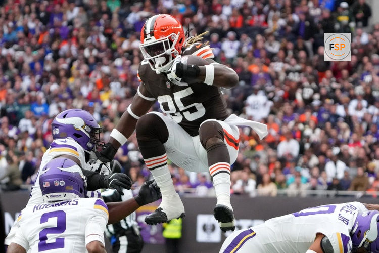 Oct 5, 2025; Tottenham, United Kingdom; Cleveland Browns tight end David Njoku (85) leaps over Minnesota Vikings linebacker Ivan Pace Jr. (0) during the third quarter of an NFL International Series game at Tottenham Hotspur Stadium. Credit: Kirby Lee-Imagn Images