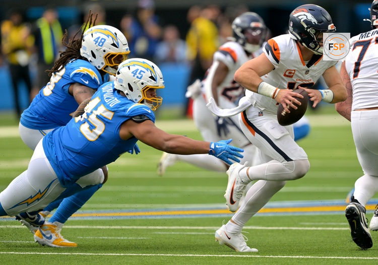 Sep 21, 2025; Inglewood, California, USA;  Denver Broncos quarterback Bo Nix (10) is pressured by Los Angeles Chargers linebacker Tuli Tuipulotu (45) in the first half at SoFi Stadium. Credit: Jayne Kamin-Oncea-Imagn Images