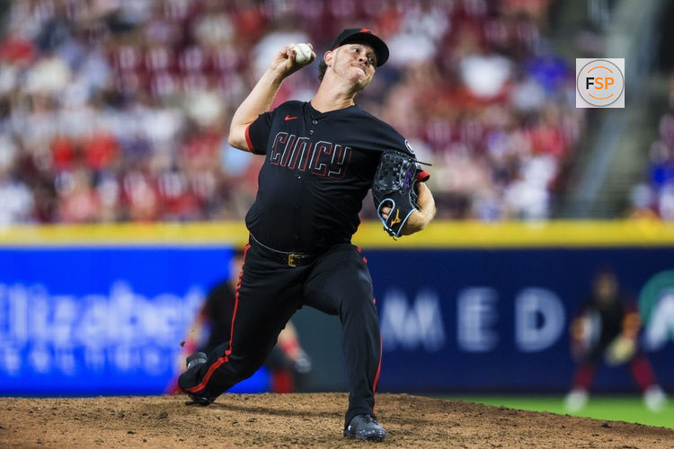 Sep 19, 2025; Cincinnati, Ohio, USA; Cincinnati Reds relief pitcher Emilio Pagan (15) pitches against the Chicago Cubs in the ninth inning at Great American Ball Park. Credit: Katie Stratman-Imagn Images