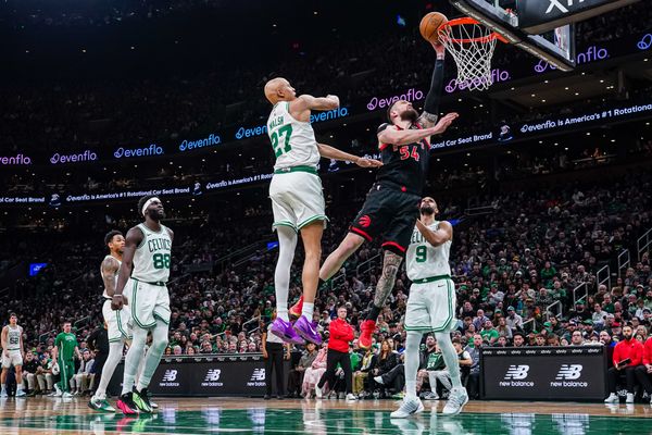 Jan 9, 2026; Boston, Massachusetts, USA; Toronto Raptors forward Sandro Mamukelashvili (54) shoots the ball  against Boston Celtics guard Jordan Walsh (27) and guard Derrick White (9) in the second half at TD Garden. Mandatory Credit: David Butler II-Imagn Images