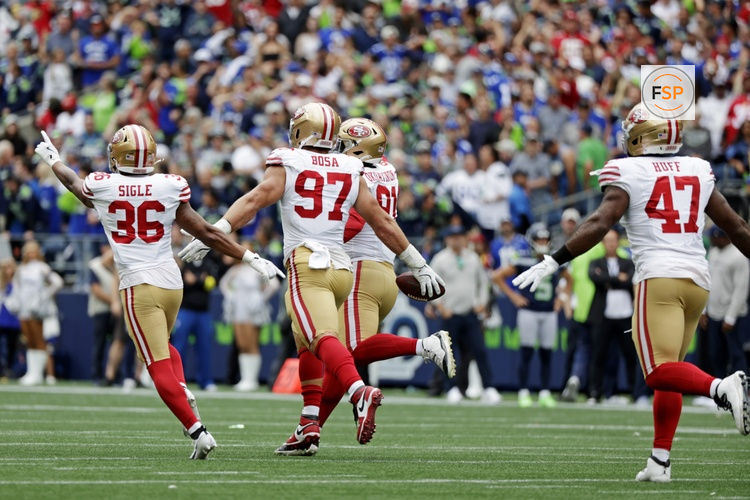 Sep 7, 2025; Seattle, Washington, USA; The San Francisco 49ers celebrate after a fumble recovery during the second half against the Seattle Seahawks during the fourth quarter at Lumen Field. Credit: Joe Nicholson-Imagn Images