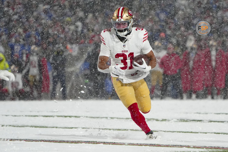 Dec 1, 2024; Orchard Park, New York, USA; San Francisco 49ers running back Isaac Guerendo (31) runs with the ball for a touchdown against the Buffalo Bills during the second half at Highmark Stadium. Credit: Gregory Fisher-Imagn Images