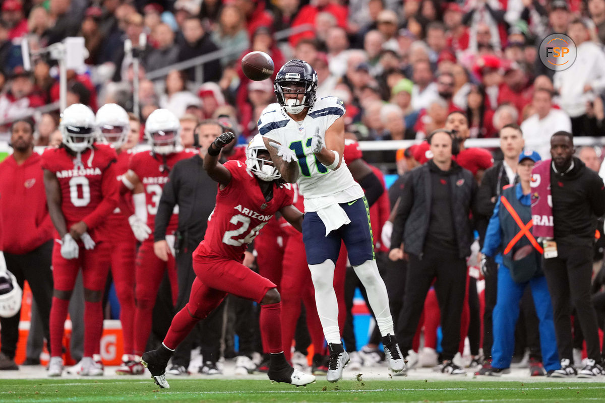 Jan 7, 2024; Glendale, Arizona, USA; Seattle Seahawks wide receiver Jaxon Smith-Njigba (11) makes a catch against Arizona Cardinals cornerback Starling Thomas V (24) during the first half at State Farm Stadium. Credit: Joe Camporeale-USA TODAY Sports