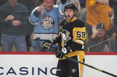 Mar 21, 2026; Pittsburgh, Pennsylvania, USA;  Pittsburgh Penguins right wing Egor Chinakhov (59) reacts after scoring a goal against the Winnipeg Jets during the first period at PPG Paints Arena. Mandatory Credit: Charles LeClaire-Imagn Images