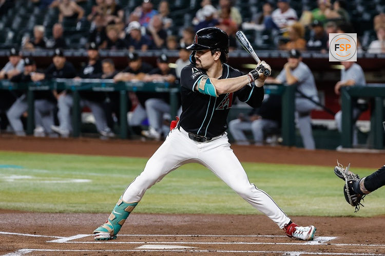 PHOENIX, AZ - JUNE 14:  Arizona Diamondbacks outfielder Corbin Carroll (7) awaits the pitch during the MLB baseball game between the Chicago White Sox and the Arizona Diamondbacks on June 14, 2024 at Chase Field in Phoenix, Arizona. (Photo by Kevin Abele/Icon Sportswire)