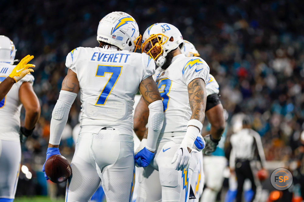 JACKSONVILLE, FL - JANUARY 14: Los Angeles Chargers tight end Gerald Everett (7) and Los Angeles Chargers wide receiver Keenan Allen (13) celebrate a touchdown during the game between the Los Angeles Chargers and the Jacksonville Jaguars on January 14, 2023 at TIAA Bank Field in Jacksonville, Fl. (Photo by David Rosenblum/Icon Sportswire)