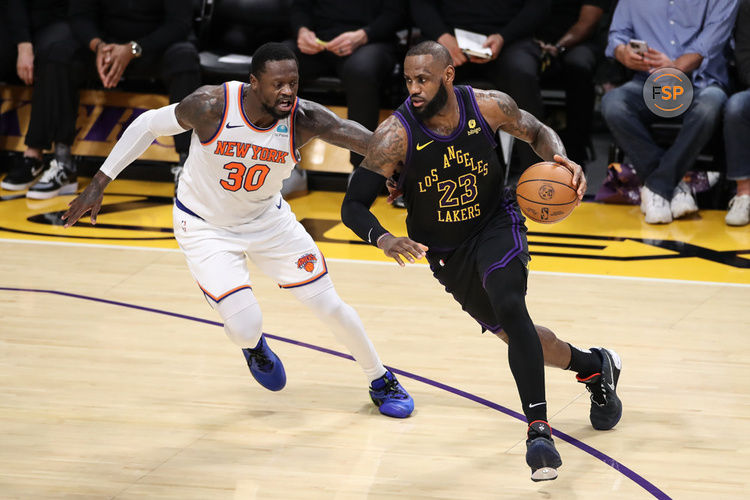 LOS ANGELES, CA - DECEMBER 18: Los Angeles Lakers forward LeBron James (23) drives on New York Knicks forward Julius Randle (30) during the NBA game between the New York Knicks and the Los Angeles Lakers on December 18, 2023, at Crypto.com Arena in Los Angeles, CA. (Photo by Jevone Moore/Icon Sportswire)