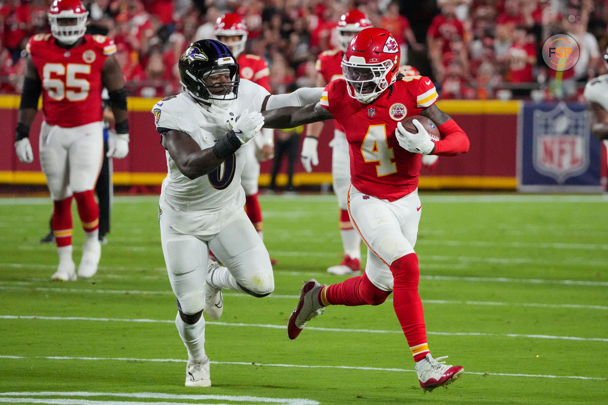 Sep 5, 2024; Kansas City, Missouri, USA; Kansas City Chiefs wide receiver Rashee Rice (4) runs the ball as Baltimore Ravens linebacker Roquan Smith (0) defends during the first half at GEHA Field at Arrowhead Stadium. Credit: Denny Medley-Imagn Images