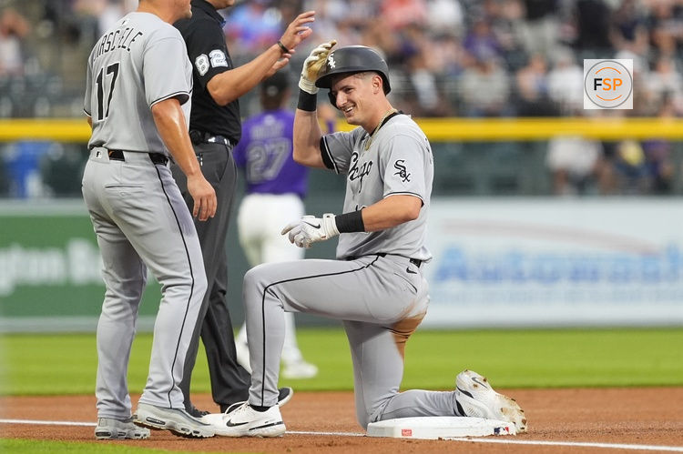Jul 5, 2025; Denver, Colorado, USA; Chicago White Sox shortstop Colson Montgomery (12) triples in the first inning against the Colorado Rockies at Coors Field. Credit: Ron Chenoy-Imagn Images