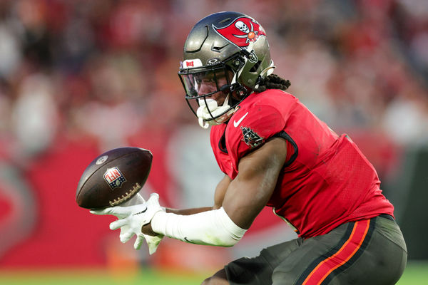 Dec 24, 2023; Tampa, Florida, USA;  Tampa Bay Buccaneers running back Rachaad White (1) bobbles a pass against the Jacksonville Jaguars in the third quarter at Raymond James Stadium. Mandatory Credit: Nathan Ray Seebeck-USA TODAY Sports