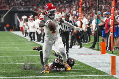 Sep 22, 2024; Atlanta, Georgia, USA; Kansas City Chiefs wide receiver Rashee Rice (4) scores a touchdown past Atlanta Falcons cornerback Dee Alford (20) during the first half at Mercedes-Benz Stadium. Mandatory Credit: Dale Zanine-Imagn Images