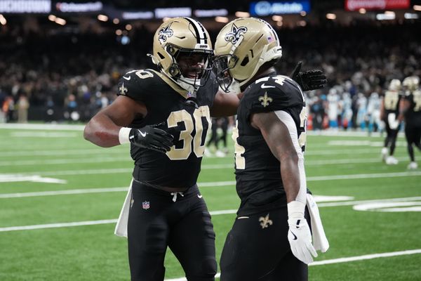 Dec 14, 2025; New Orleans, Louisiana, USA; New Orleans Saints running back Devin Neal (24) celebrates with running back Audric Estime (30) after scoring a touchdown during the second quarter against the Carolina Panthers at Caesars Superdome. Mandatory Credit: Matthew Hinton-Imagn Images