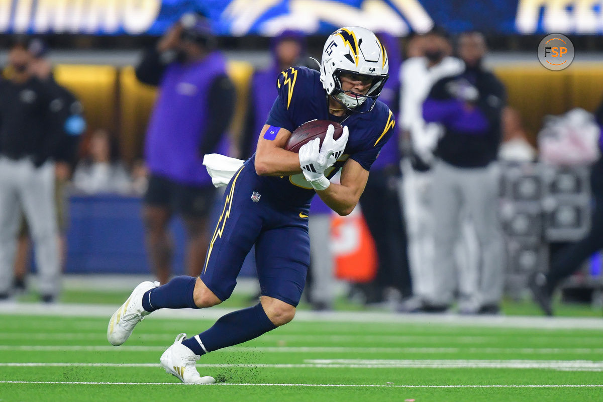 Nov 25, 2024; Inglewood, California, USA; Los Angeles Chargers wide receiver Ladd McConkey (15) runs the ball against the Baltimore Ravens during the second half at SoFi Stadium. Credit: Gary A. Vasquez-Imagn Images