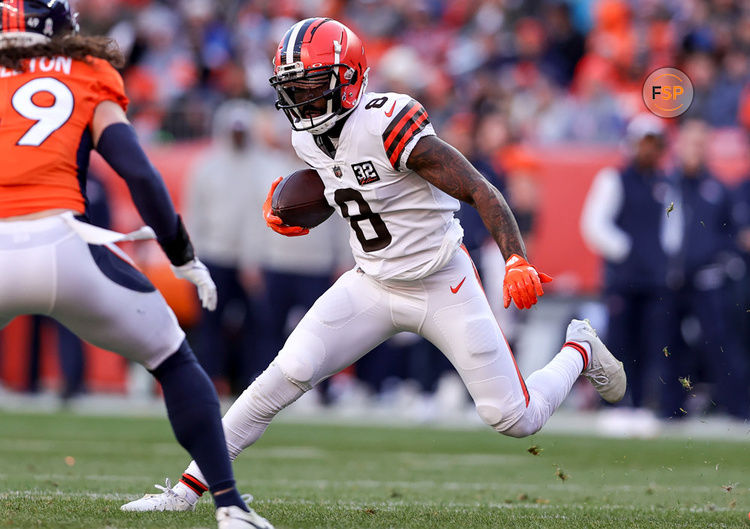 DENVER, CO - NOVEMBER 26: Cleveland Browns wide receiver Elijah Moore (8) looks to get past Denver Broncos linebacker Alex Singleton (49) after making a reception during an NFL game between the Cleveland Browns and the Denver Broncos on November 26, 2023 at Empower Field at Mile High in Denver, CO. (Photo by Steve Nurenberg/Icon Sportswire)