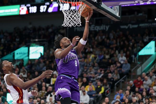 Jan 24, 2026; Salt Lake City, Utah, USA;  Utah Jazz guard Isaiah Collier (8) gets the basket and scores during the second half against the Miami Heat at Delta Center. Mandatory Credit: Chris Nicoll-Imagn Images