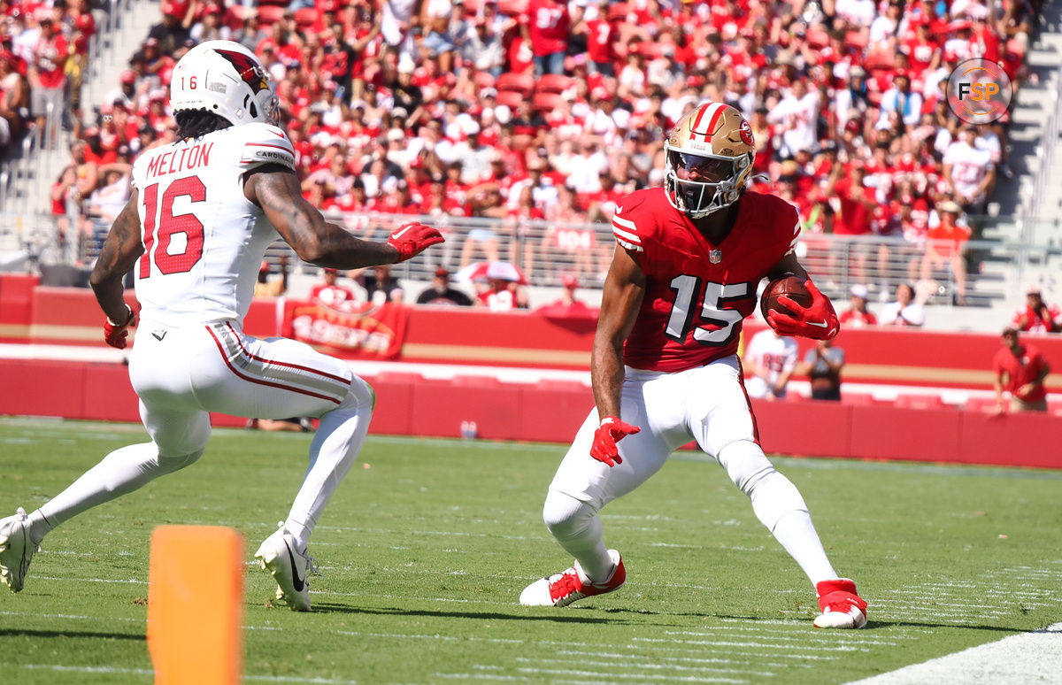 Oct 6, 2024; Santa Clara, California, USA; San Francisco 49ers wide receiver Jauan Jennings (15) controls the ball against Arizona Cardinals cornerback Max Melton (16) during the first quarter at Levi's Stadium. Credit: Kelley L Cox-Imagn Images